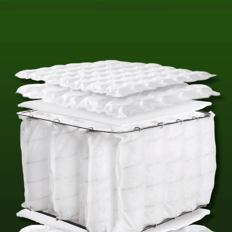 Cross-section of English Royal Mattress showcasing natural fillers and pocket springs with organic top pillow.