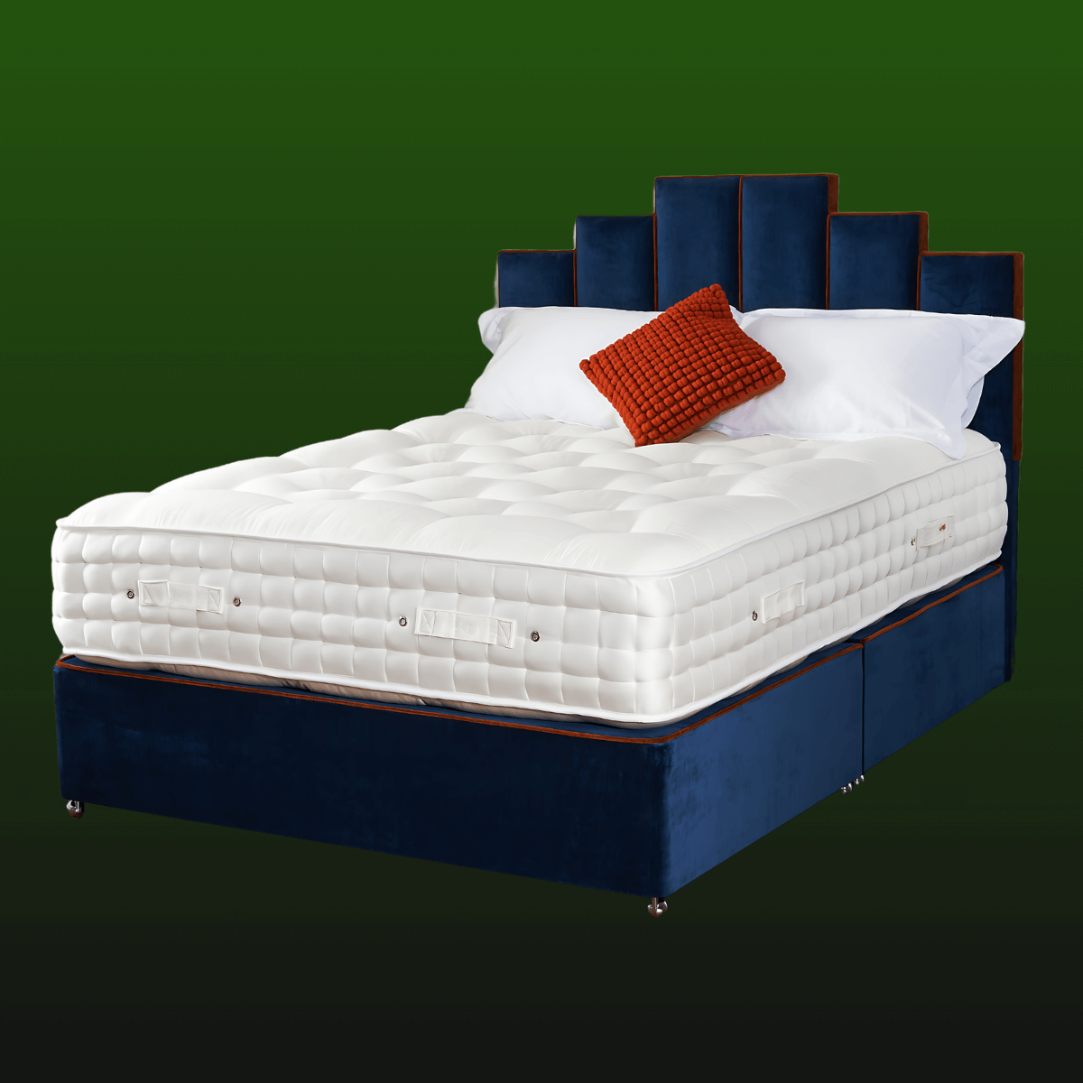 Luxurious English Royal Mattress on blue bed frame with white pillows and red cushion