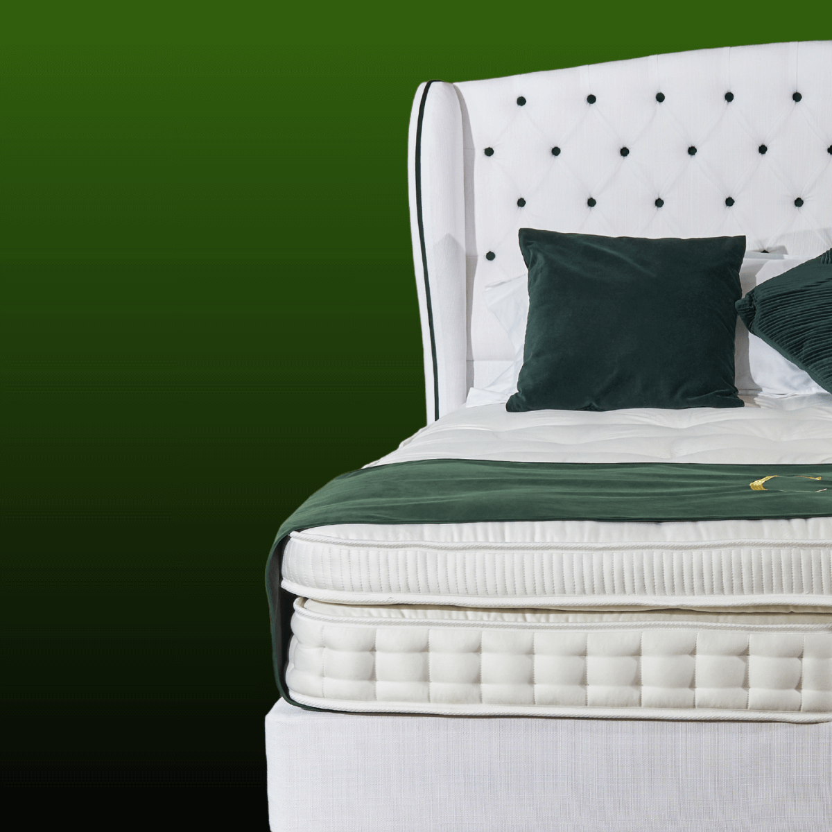 Luxury handmade British mattress with top pillow, crafted from natural fillers, featuring a plush headboard and elegant design.